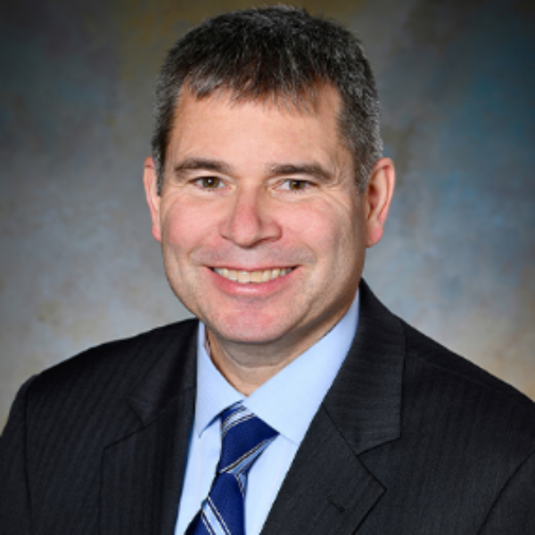 Jeffrey S. Coons, Ph.D., CFA, Chief Risk Officer at High Probability Advisors seen with a bright smile on his face